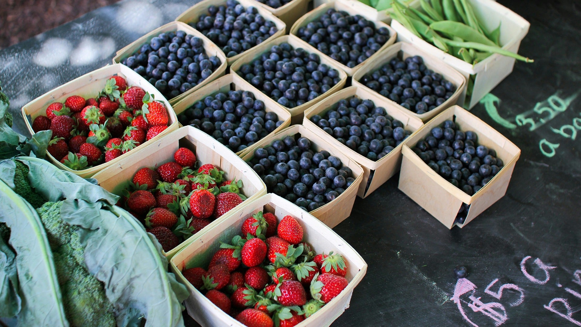 fruits and veggies on sale at a market stand