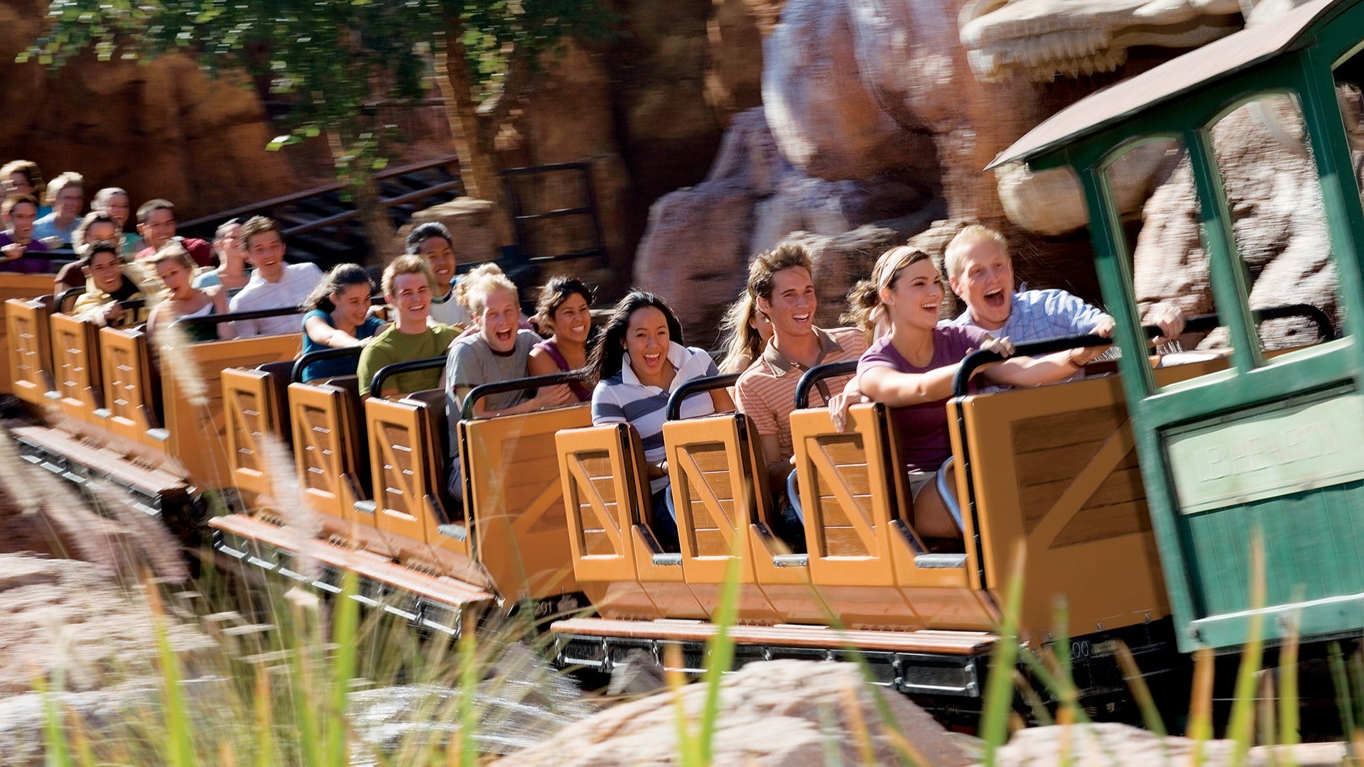 a group of people having fun riding a roller coaster