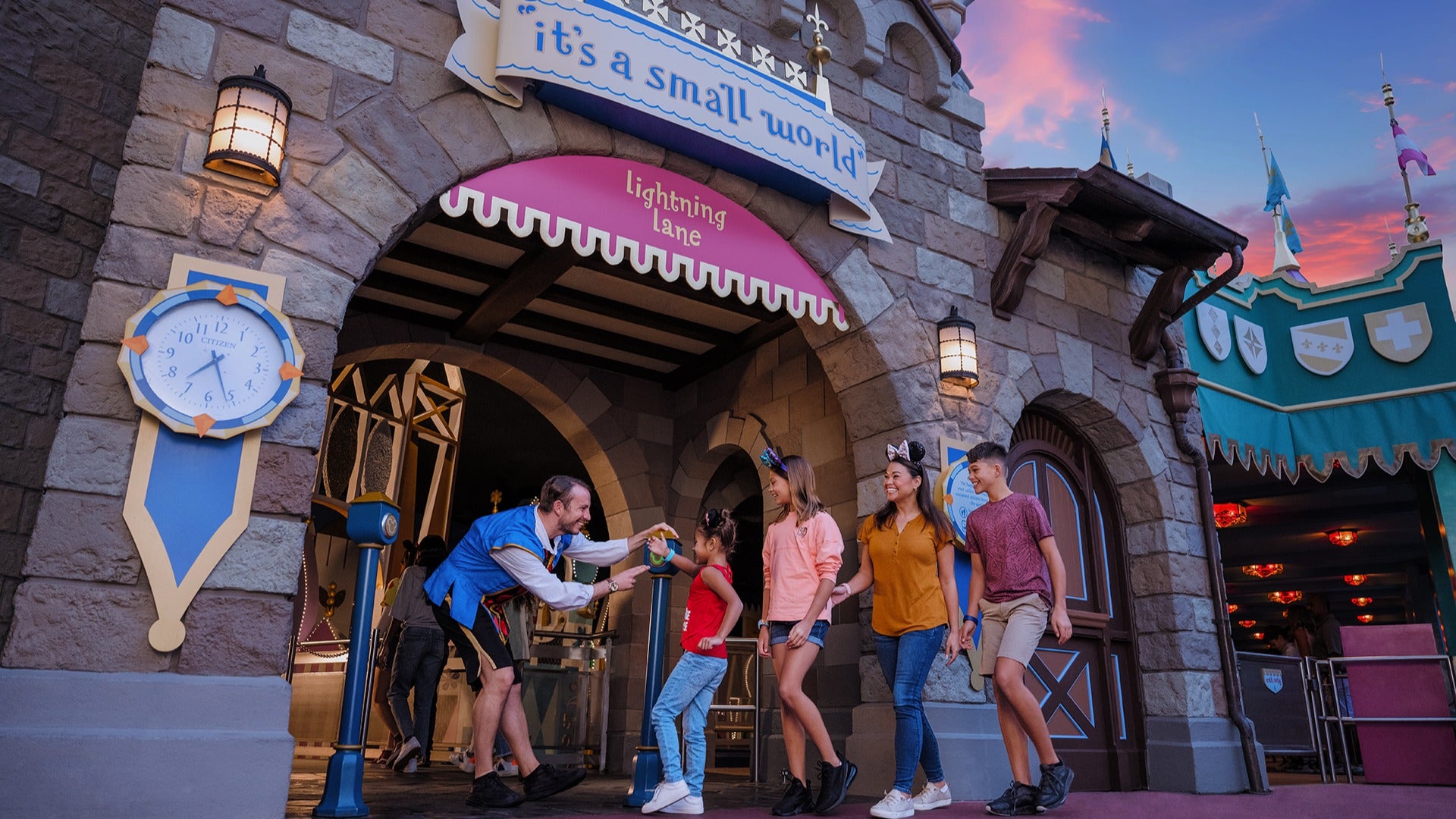 group of people entering a ride at disney world through the lightning lane