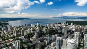 Vancouver skyline with bay and mountains in the distance
