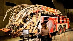a broken firetruck on display in a museum