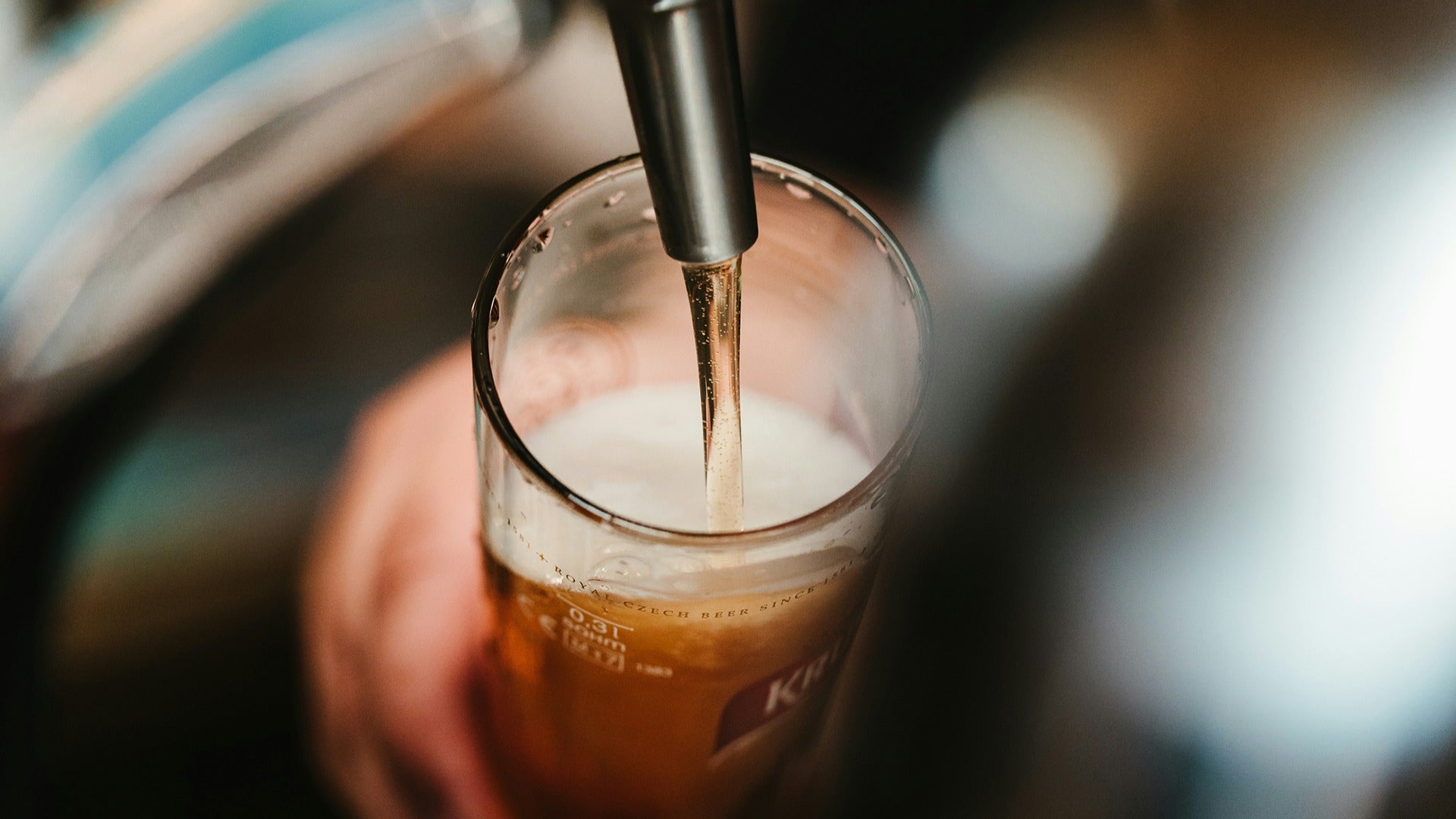 tap pouring beer in a glass