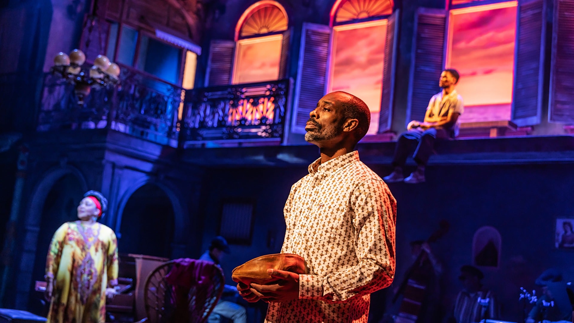 stage actors performing a scene on broadway