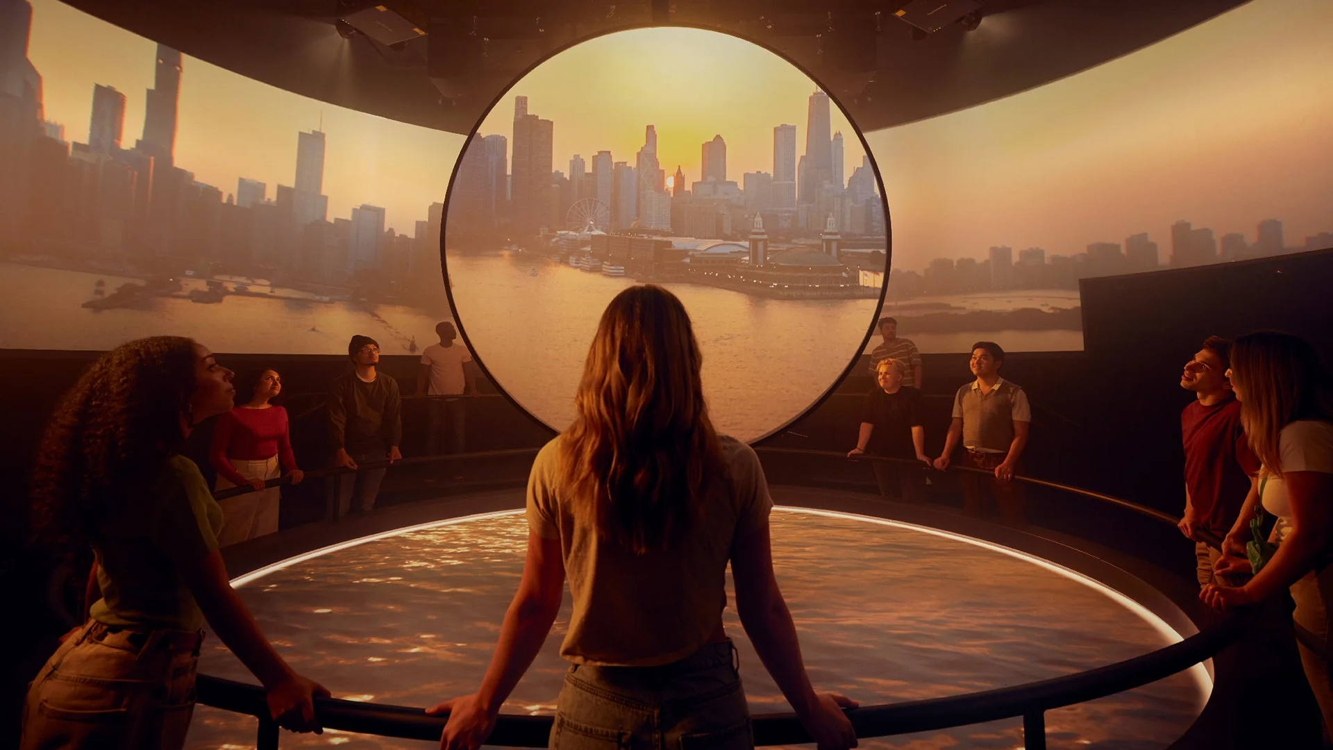 a group of people staring at an exhibit of the chicago skyline