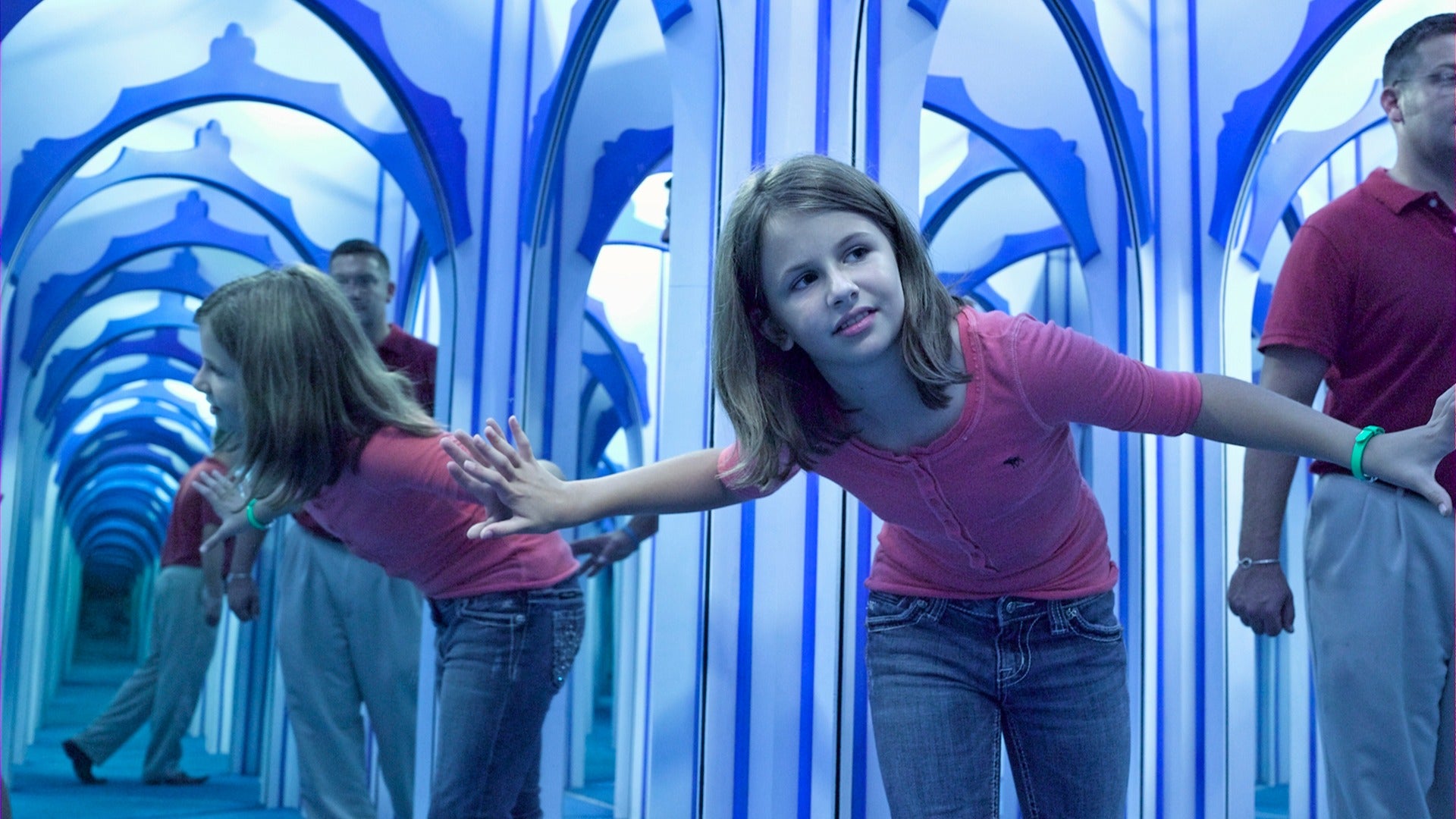 a child looking through a maze of mirrors