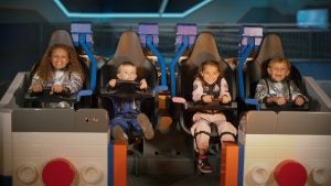 kids on the new galacticoaster ride at legoland