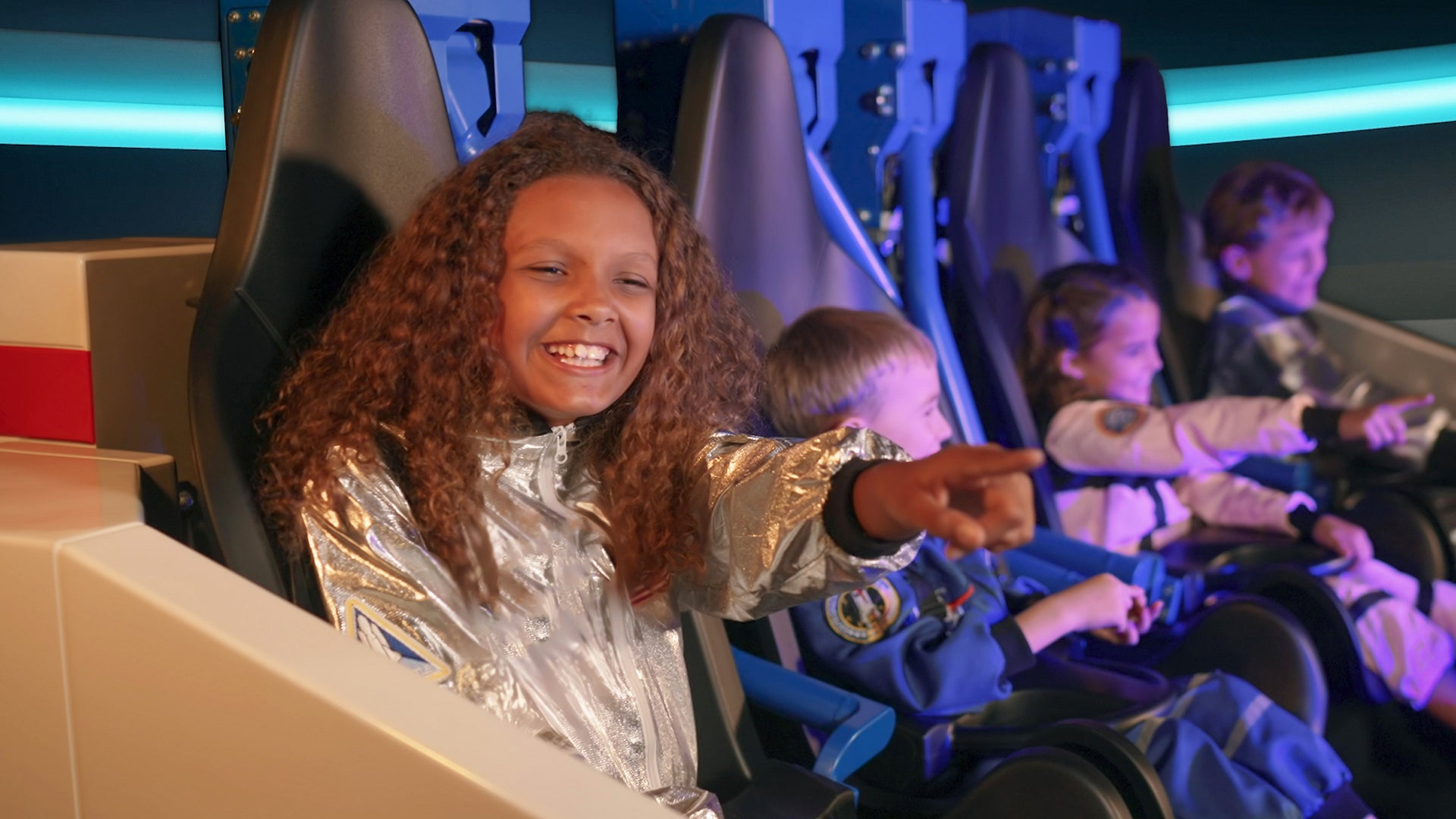 kids on the new galacticoaster ride at legoland