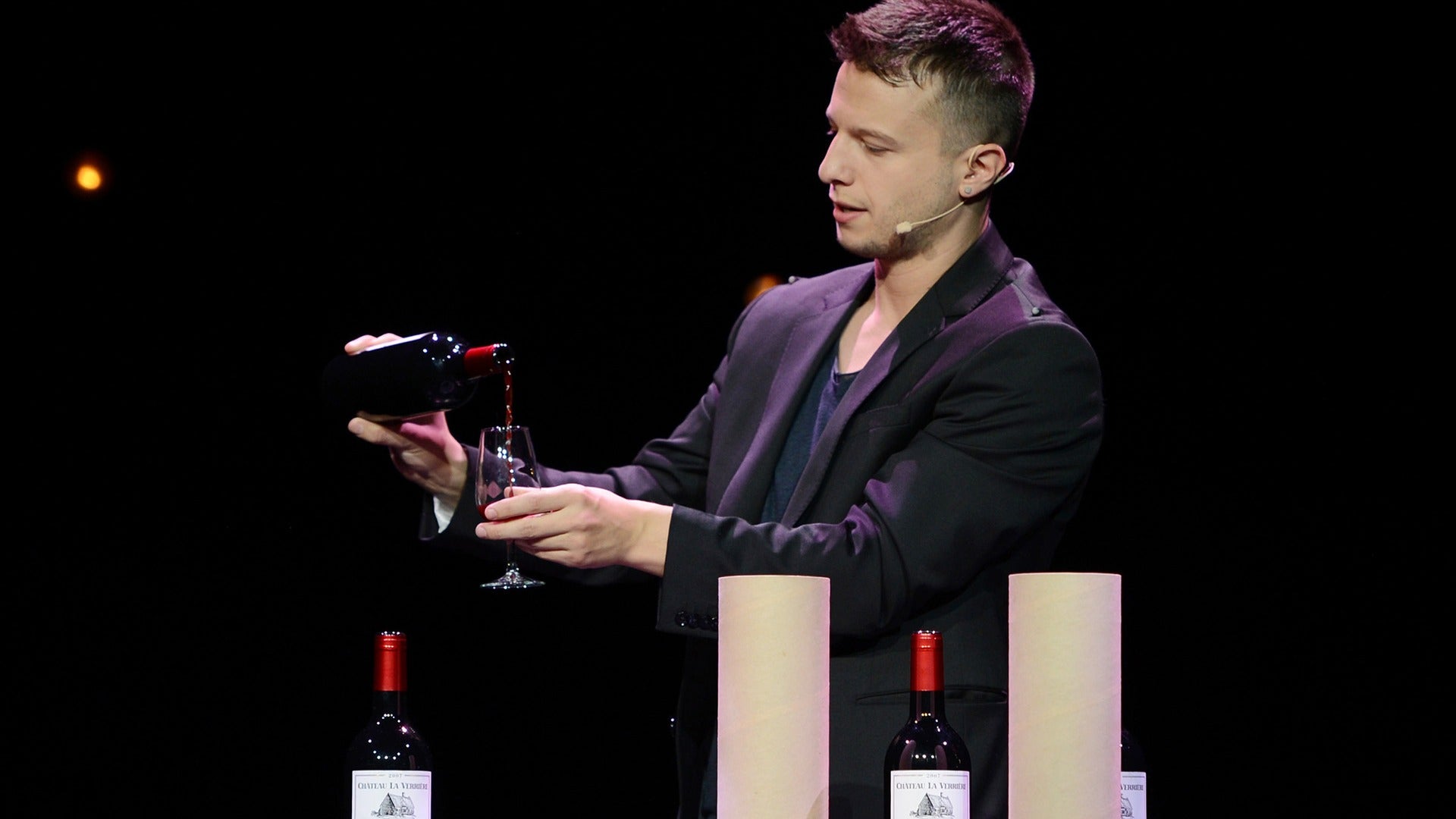 a magician performing tricks with wine