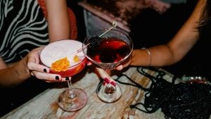girls drinking cocktails in a bar