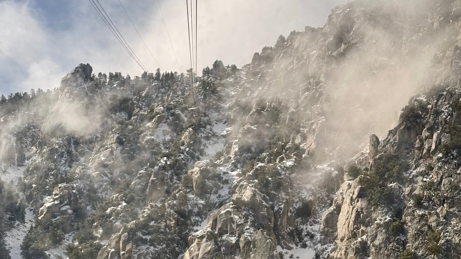 View of cable lines and cliff face while on the Palm Springs Aerial Tramway