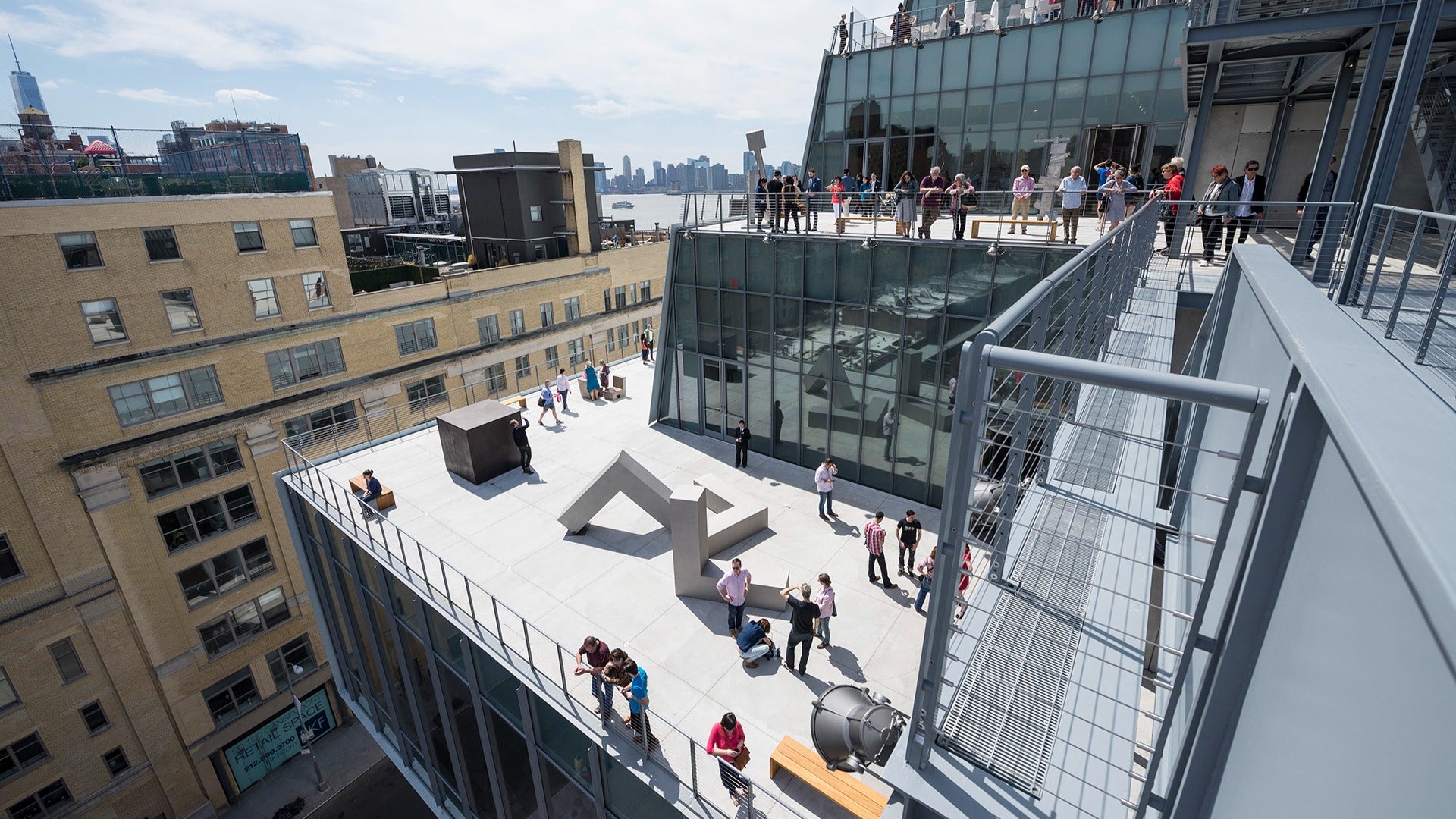 a group of people on an overlooking deck with seating areas
