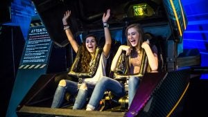 two girls strapped in on a fun ride