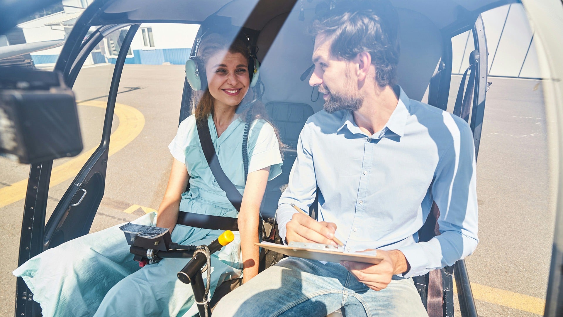 a couple riding a helicopter together