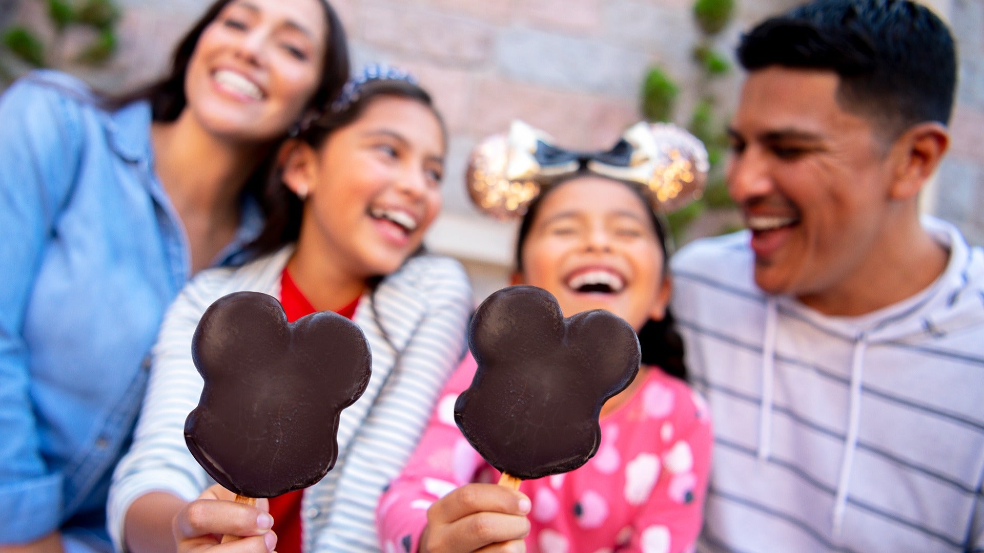 a family enjoying ice cream at disneyland