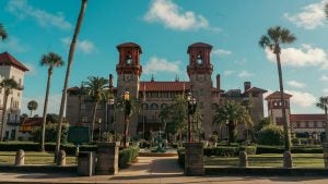 a photo of a museum with a fountain in front and trees on the side
