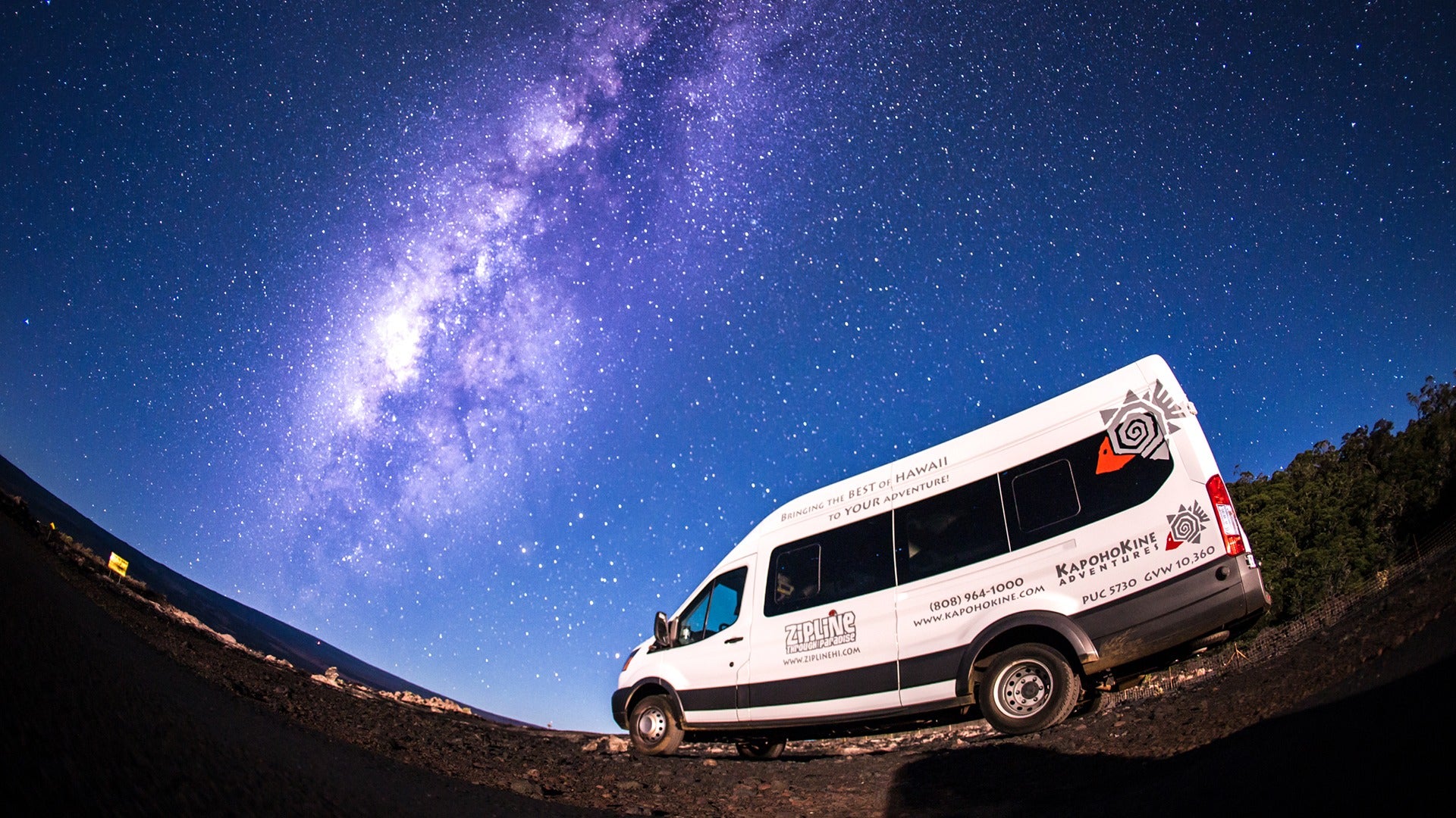 a white van under the night sky with lots of stars