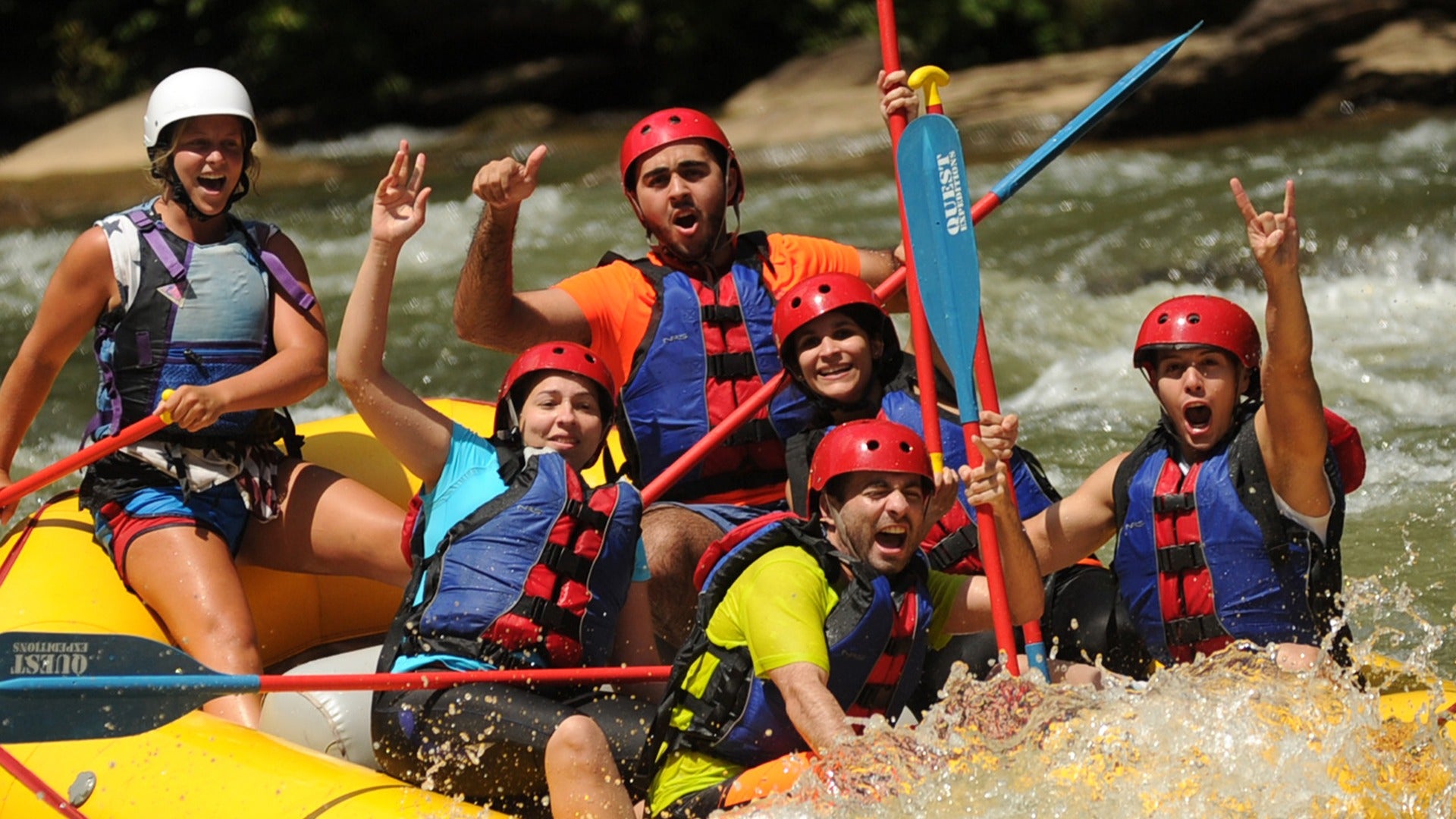 people rafting and having fun down the river