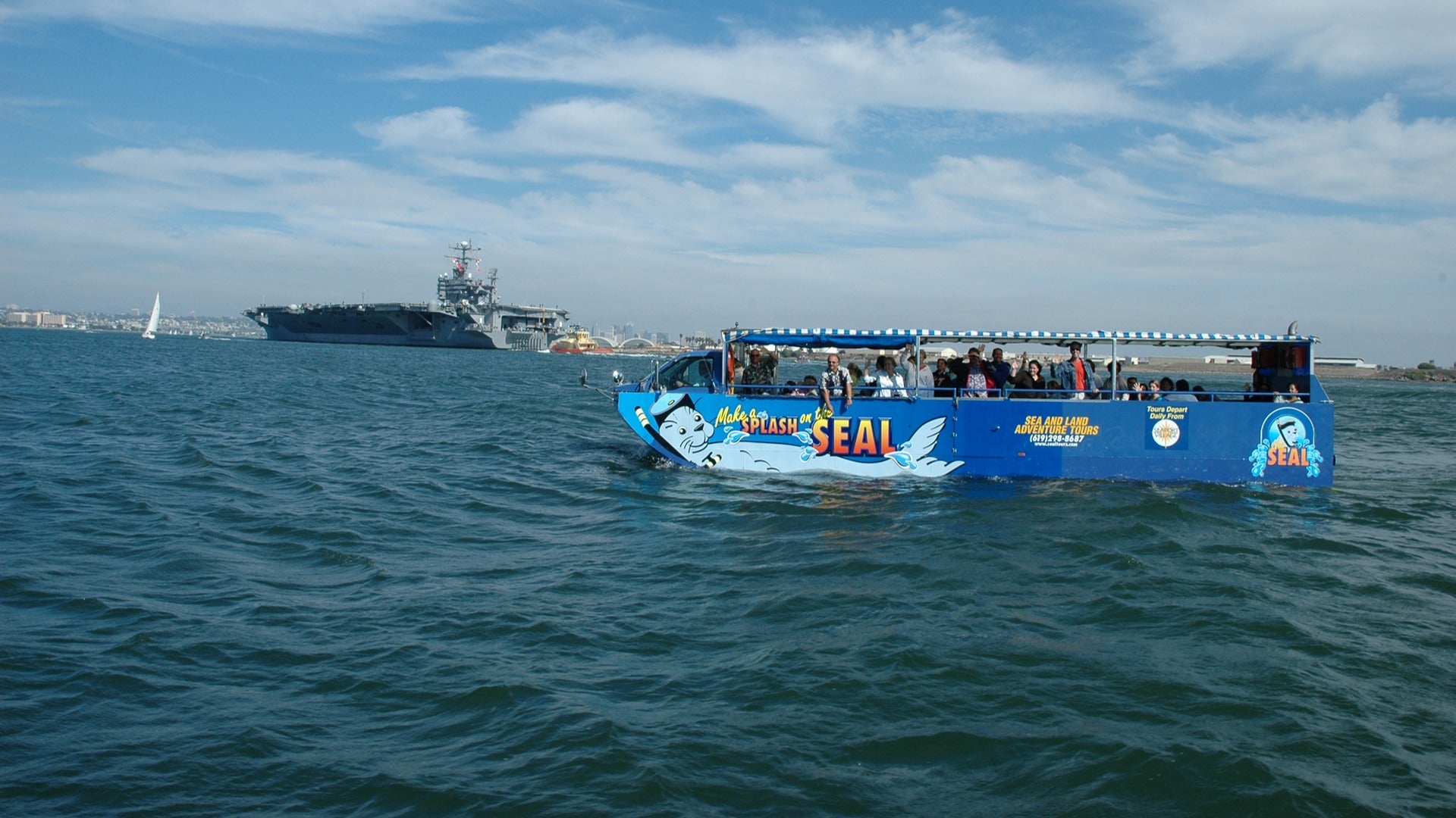 people aboard a boat during a seal tour