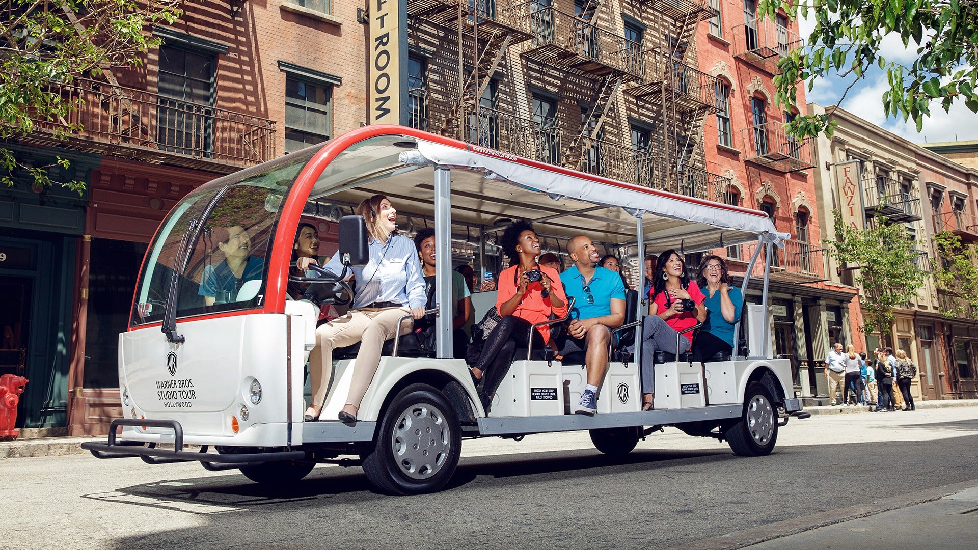 a group of people in a tour trolley