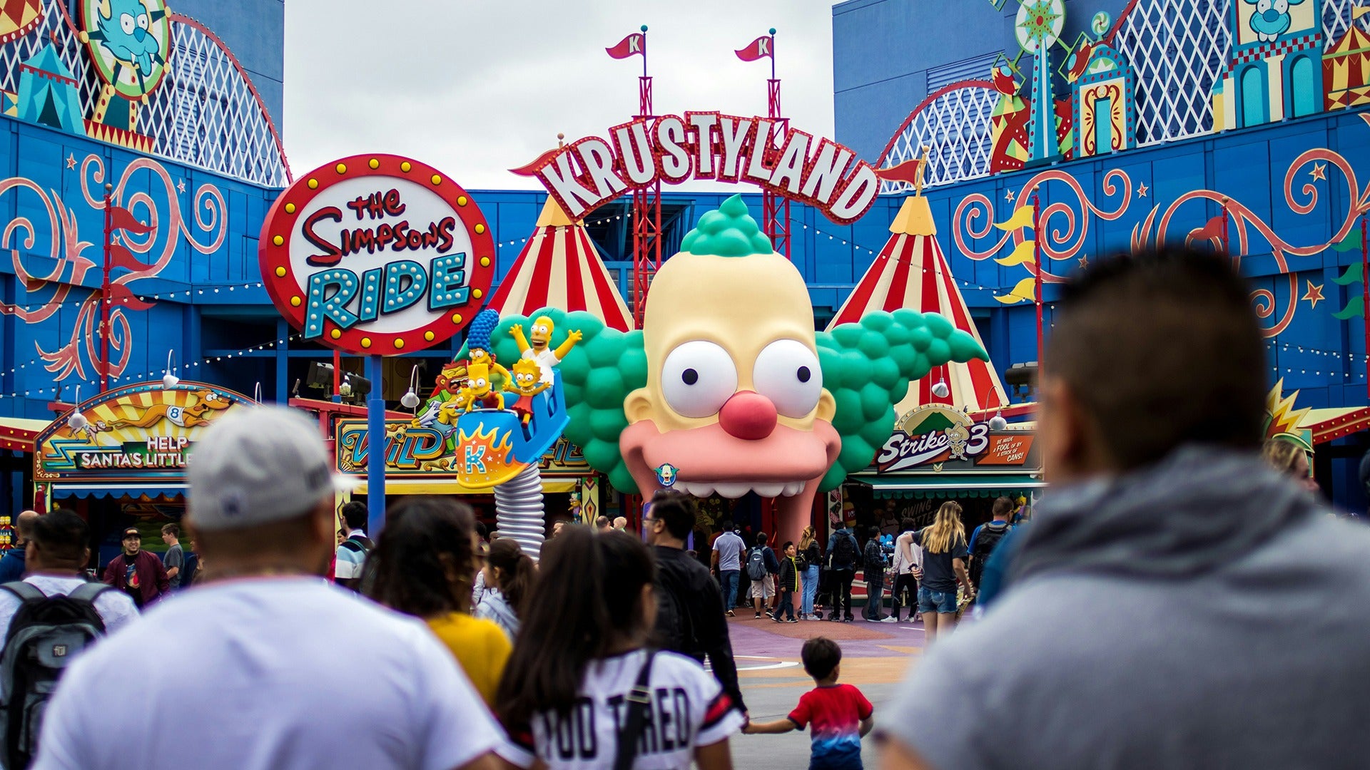 a clown head as a ride entrance with people entering