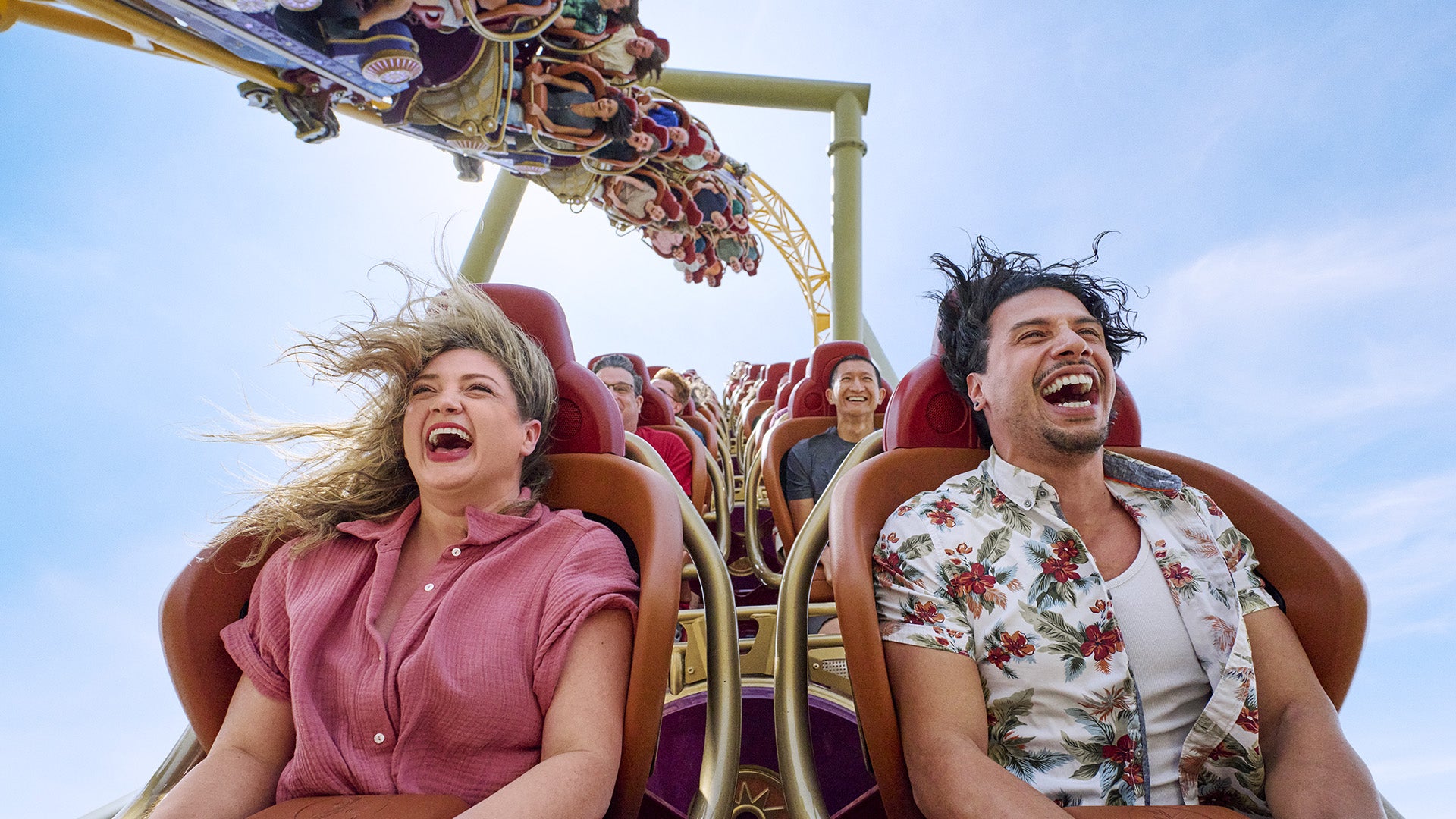 a roller coaster with people happily enjoying the ride