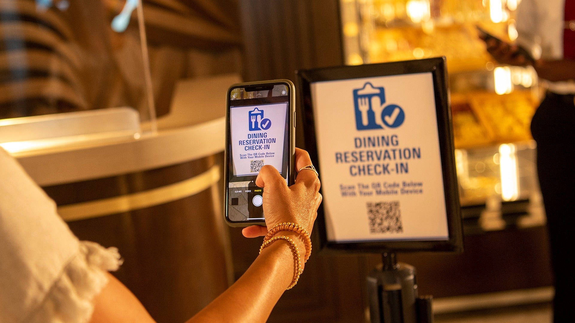 a guest using the disney app for a restaurant