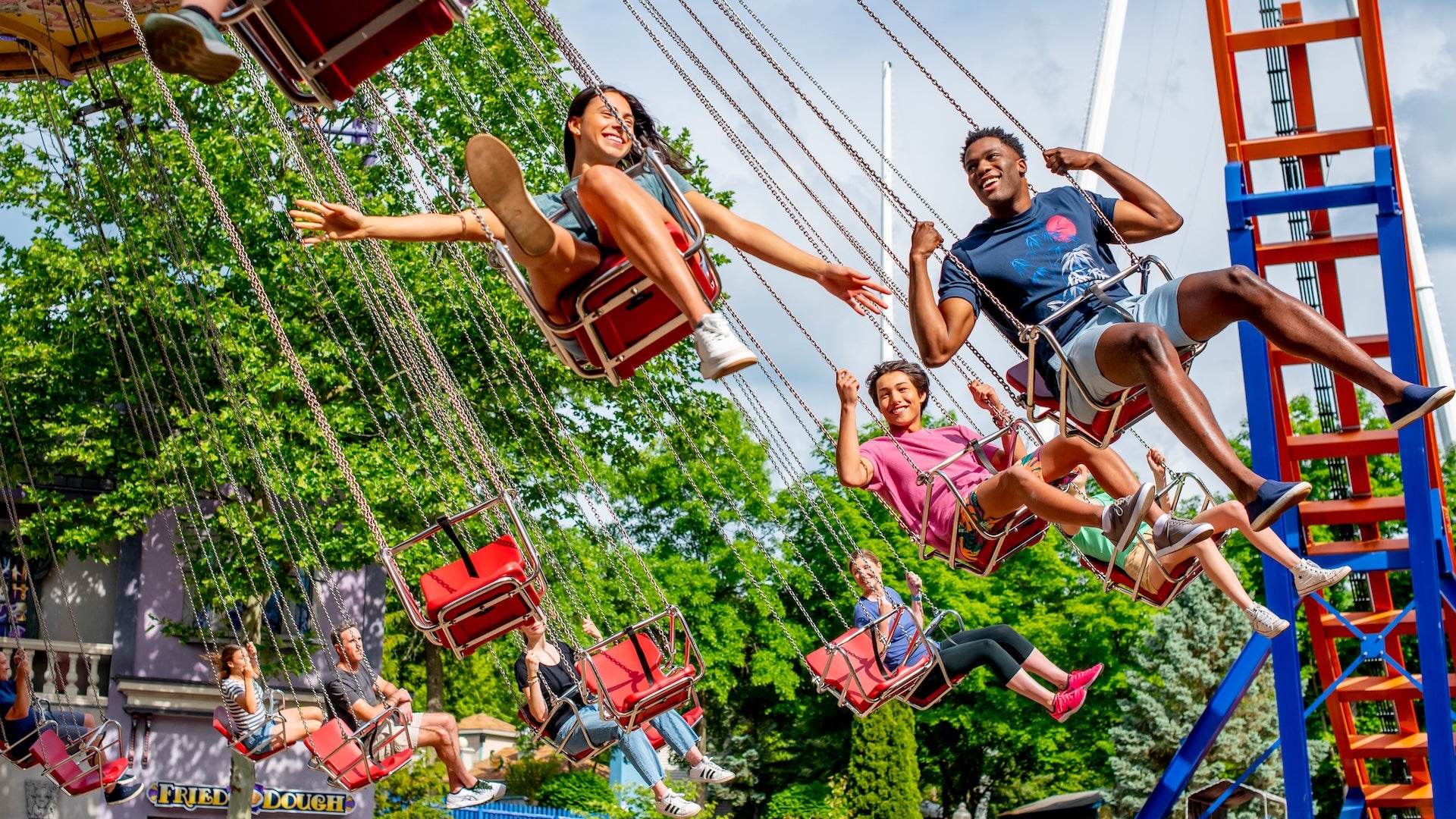 People on a swing at lake compounce park