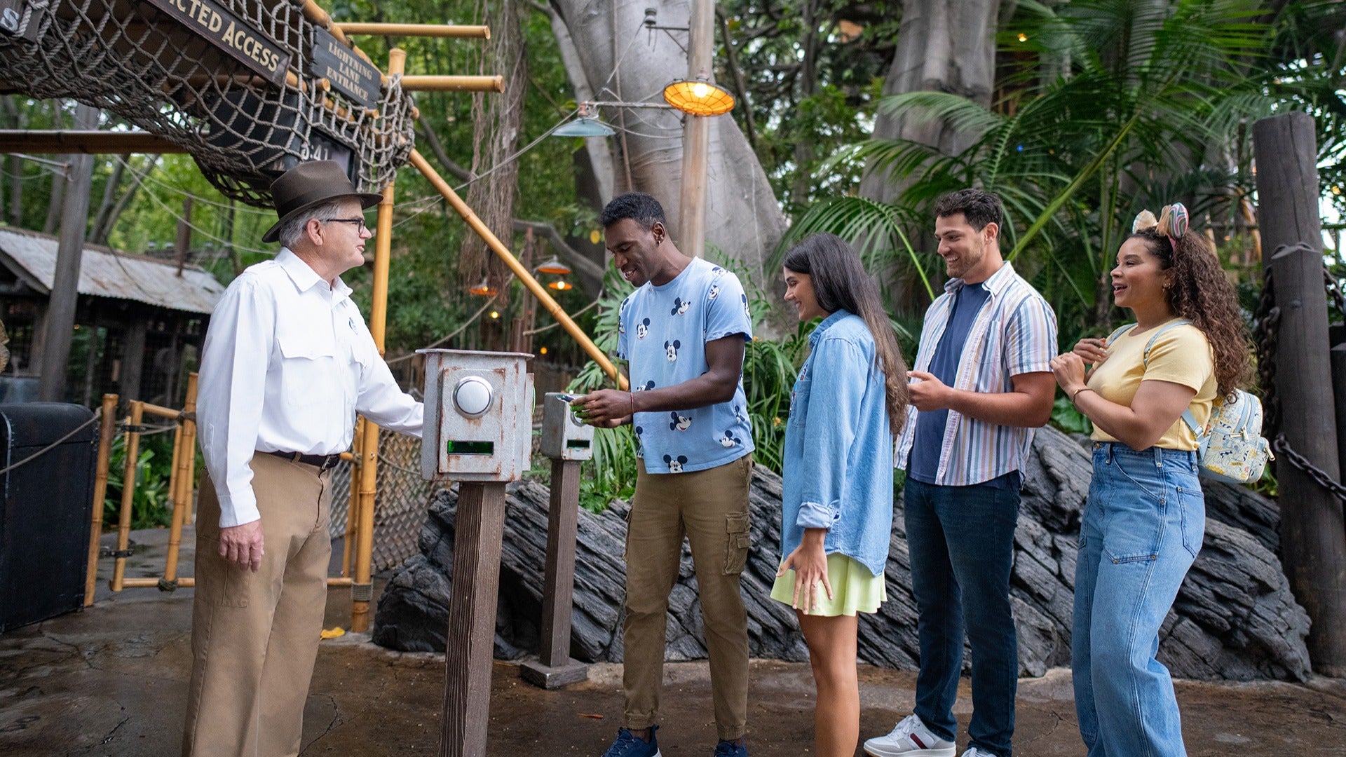 a group of friends in line at lightning lane for a disneyland ride