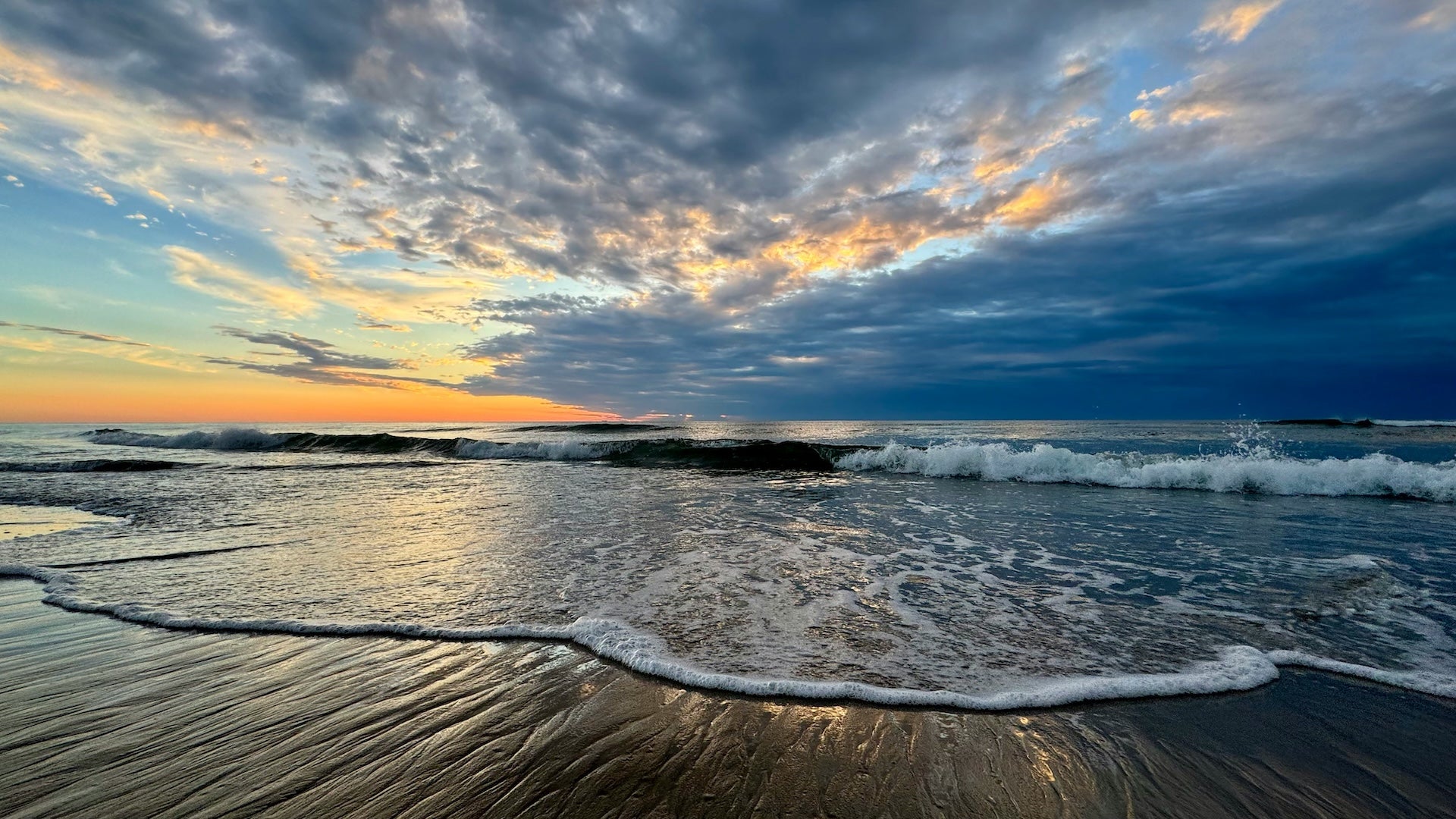 Beach at sunset with clouds