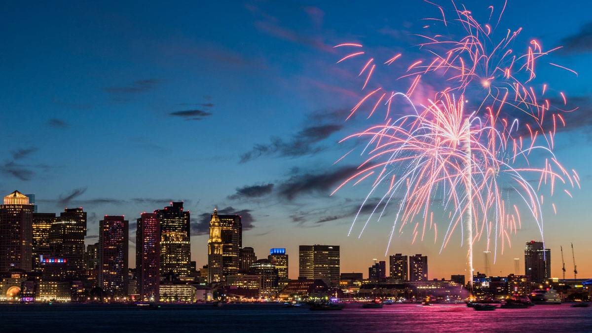 a firework display in the coast of a city