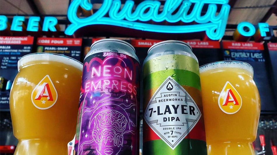close up of drinks with neon sign in background at Austin Beerworks in Austin, Texas, USA