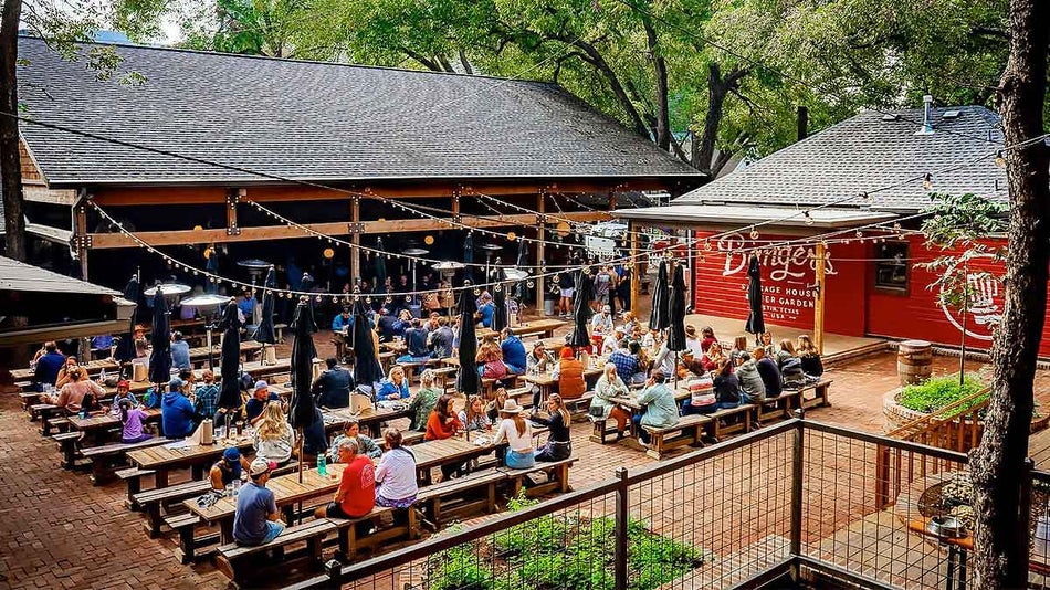 aerial view of people dining at outdoor area with trees around establishment at Banger's Sausage House & Beer Garden in Austin, Texas, USA