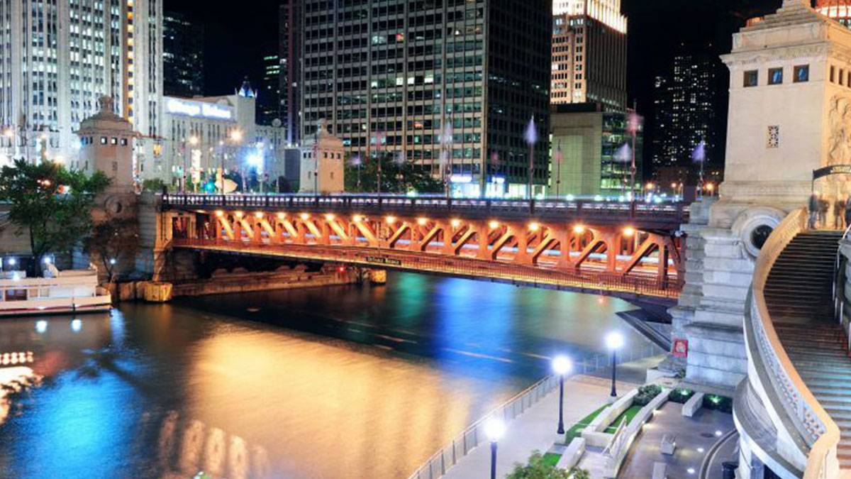 night view of lights on bridge in along riverwalk in Chicago, Illinois, USA