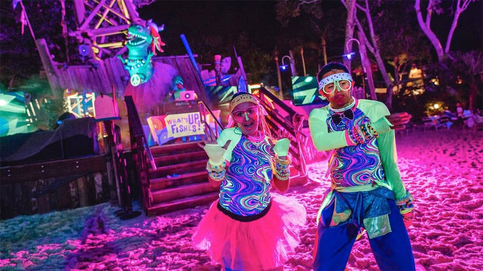 kids dancing in neon attire at Disney H20 Glow Nights