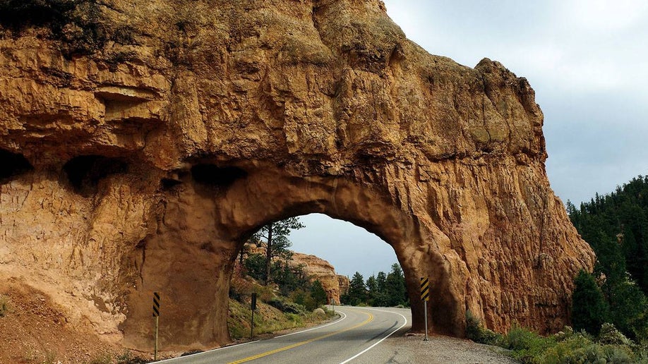Red Canyon Tunnel with trees on the side of the road in Dixie National Forest in Utah, USA