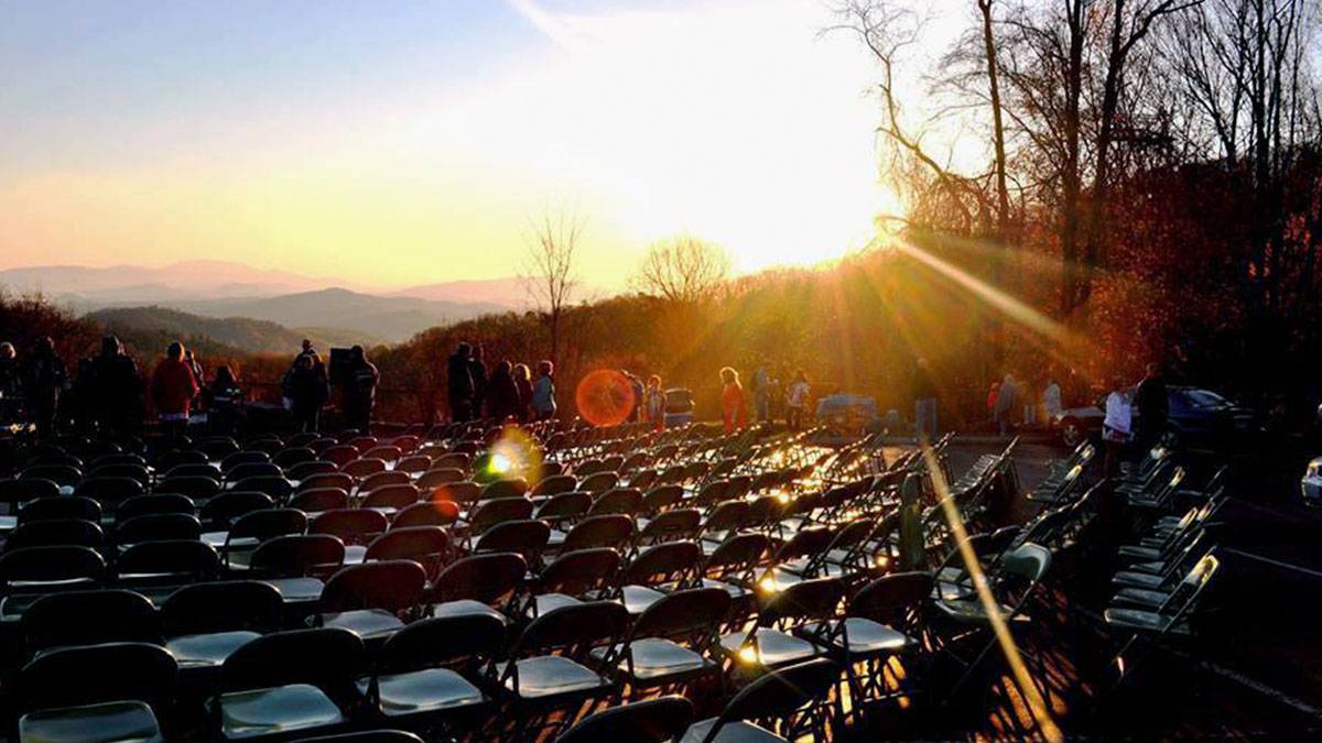 Easter Sunrise Service at Ober Gatlinburg with rising sun reflecting