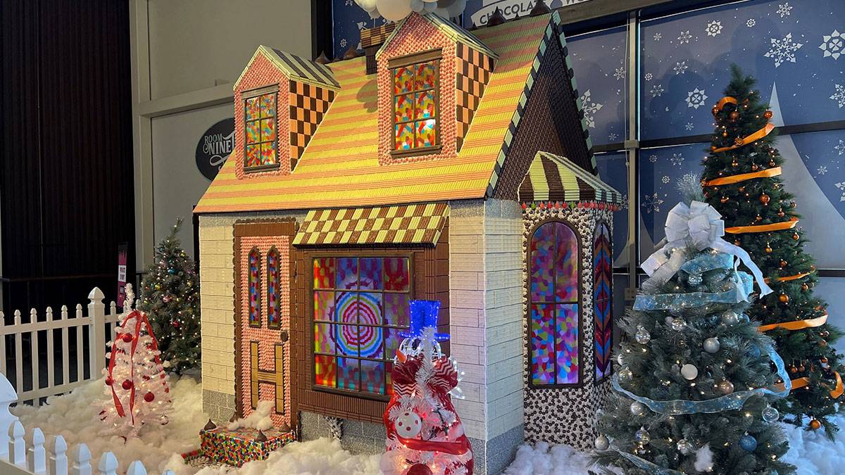 close up of hershey's chocolate house surrounded by miniature christmas themed decorations in Philadelphia, Pennsylvania, USA