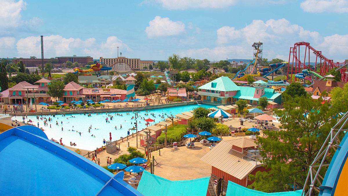 Aerial view of Hurricane Bay pool and other attractions on a sunny day with blue sky and clouds in Kentucky Kingdom in Louisville, Kentucky, USA