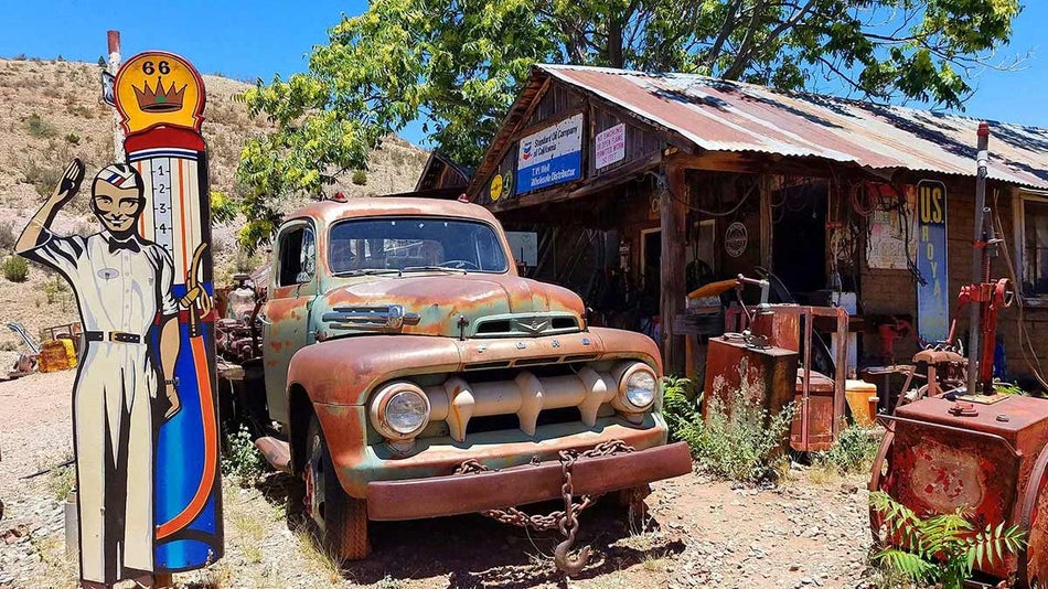 rundown garage with car and signs in Jerome Ghost Town, Arizona, USA