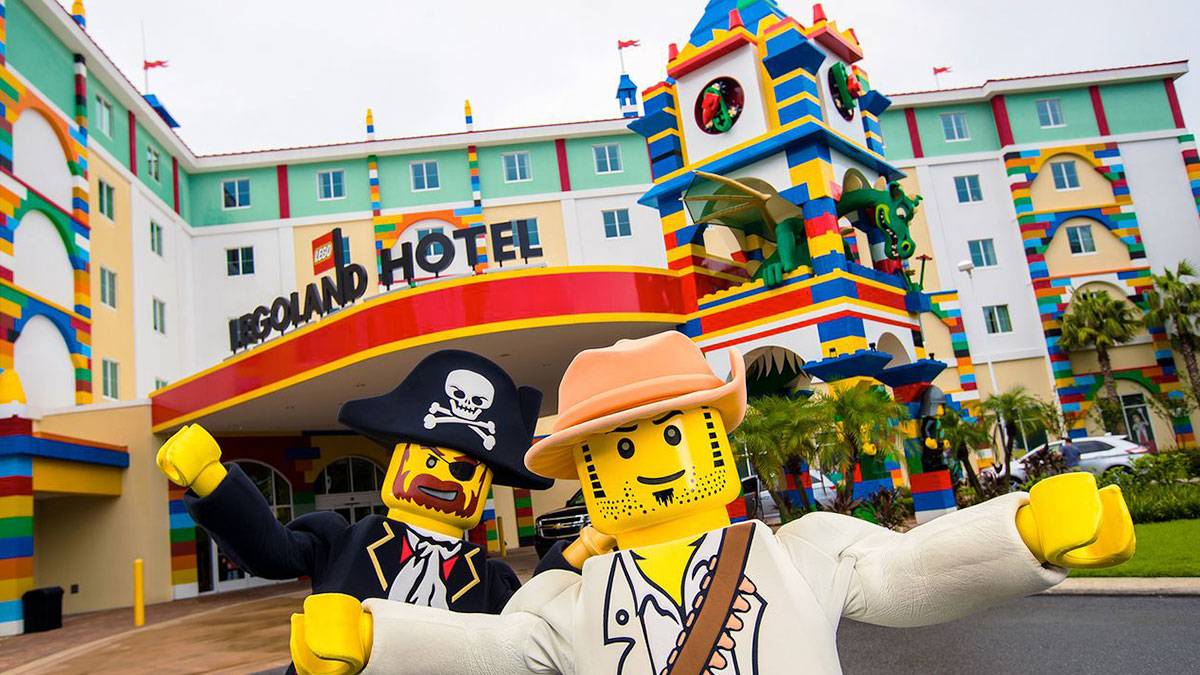 exterior of Legoland hotel with Lego characters in the foreground at Legoland Hotel New York, USA