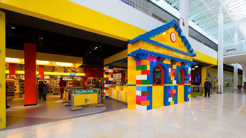 entrance to legoland discovery center with people browsing merchandise for sale in Philadelphia, Pennsylvania, USA
