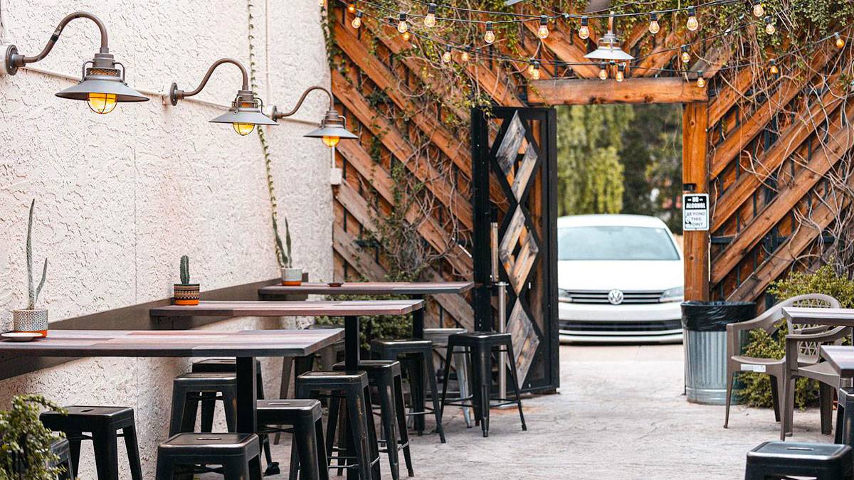 a picture of a dining restaurant with the car in the entrance