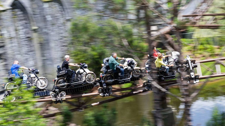 motion capture photo of people aboard the Magical Creatures Motorbike Adventure ride in Wizarding World of Harry Potter, Universal Studios, Orlando, Florida, USA