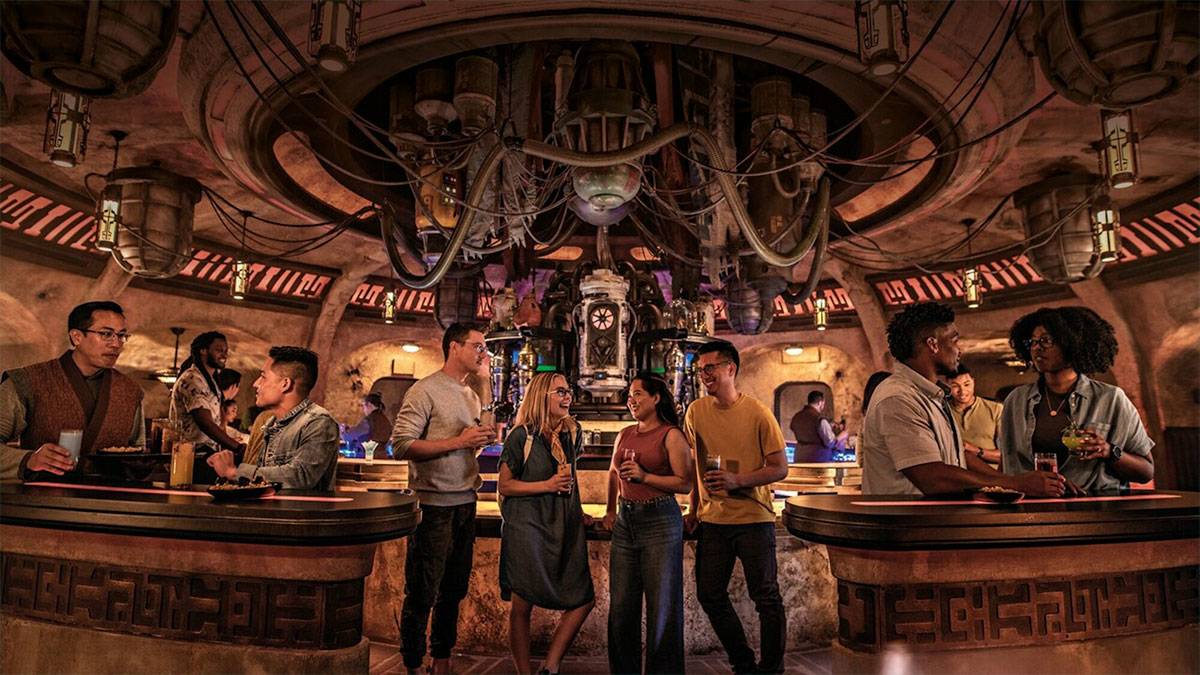 people enjoying drinks and meals in futuristic Star Wars themed restaurant in Disneyland, Anaheim, California, USA