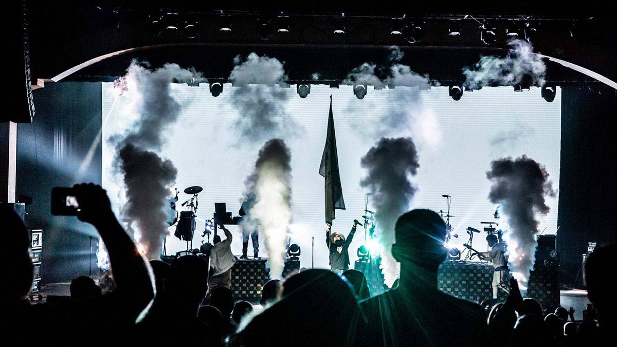 band performing on stage with smoke machines in front of crowd at Rock The Smokies Dollywood in Pigeon Forge, Tennessee, USA