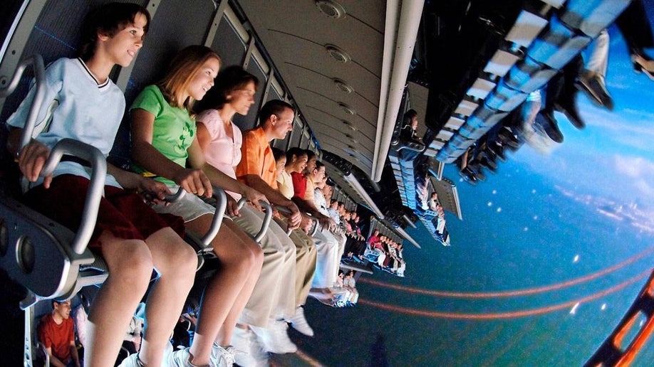 people aboard the ride Soarin’ Over California at Disneyland, Anaheim, California, USA