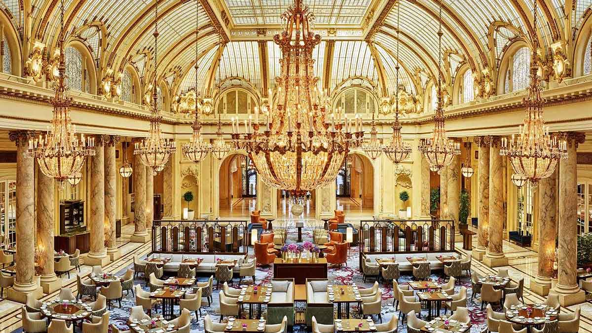 ornate lounge room with chandeliers, marble pilars, tables, chairs, at GC Lounge in The Palace Hotel, San Francisco, California, USA
