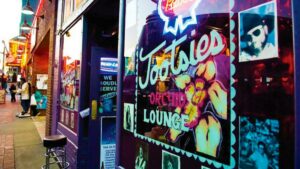 angled photo of entrance of Tootsie's Orchid Lounge showing view of street in Nashville, Tennessee, USA