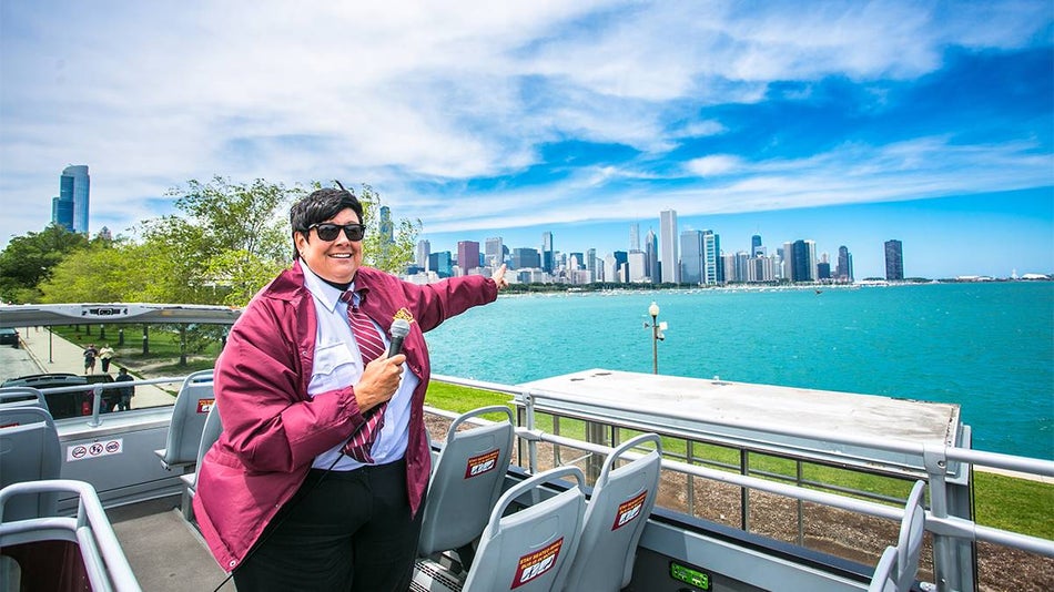 Close up of a tour guide pointing to the water on a sunny day on a Big Bus Tour in Chicago, Illinois, USA
