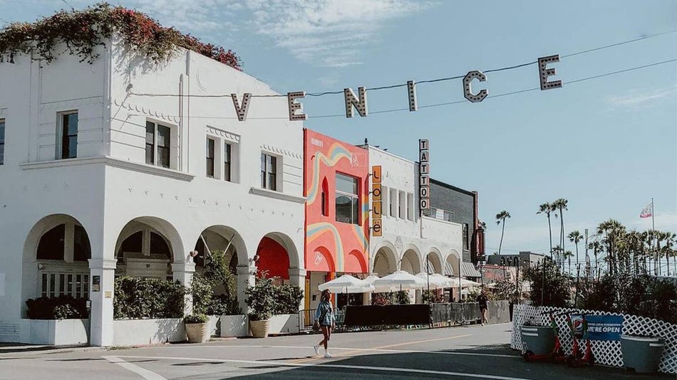 Ground view of the iconic sign for Venice Beach on a sunny day in Los Angeles, California, USA